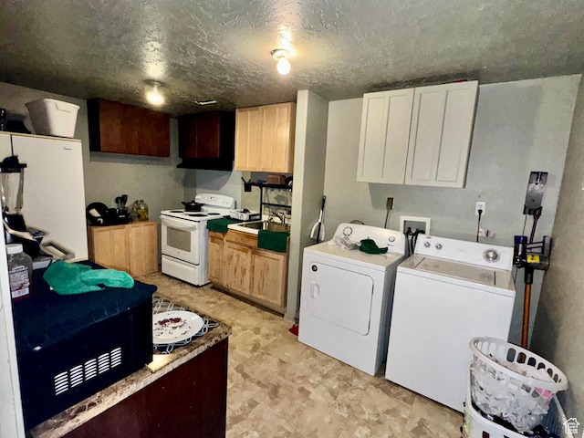 173 W Dimaggio Dr N, Tooele, UT 84074 - clothes washing area with a sink, a textured ceiling, washing machine and dryer, and laundry area