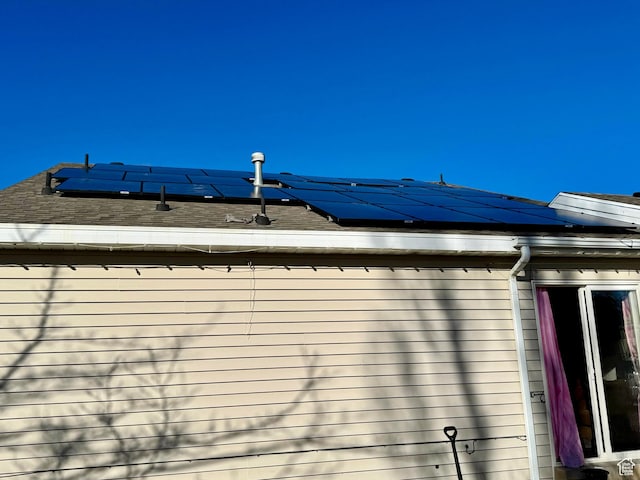 173 W Dimaggio Dr N, Tooele, UT 84074 - details with a downspout, gutters, and a shingled roof