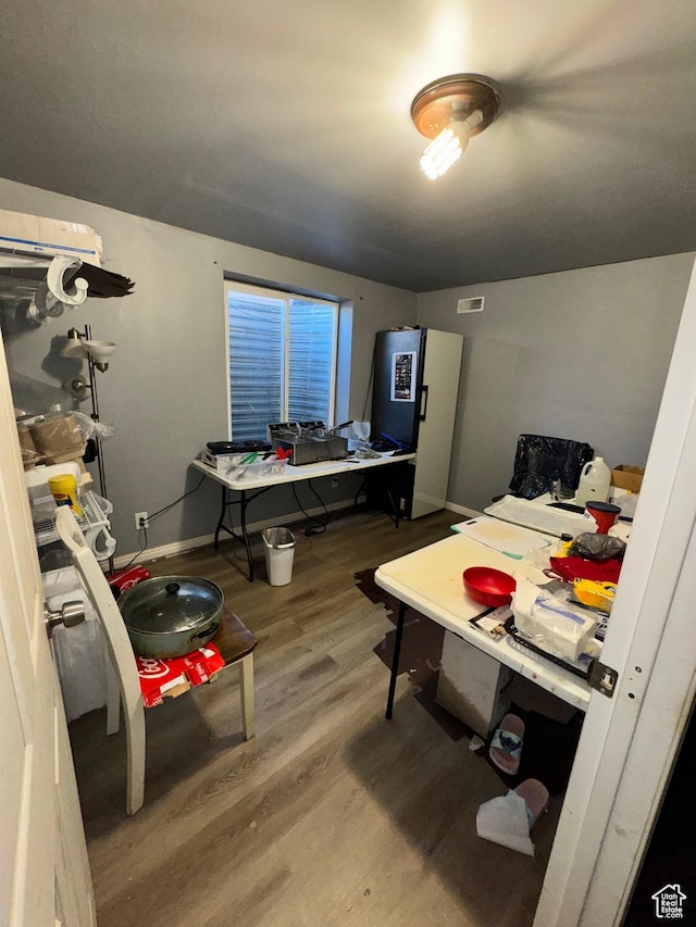 173 W Dimaggio Dr N, Tooele, UT 84074 - interior space featuring fridge, baseboards, and wood finished floors