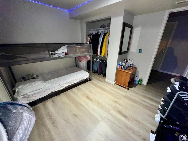 173 W Dimaggio Dr N, Tooele, UT 84074 - bedroom featuring a closet, baseboards, and wood finished floors