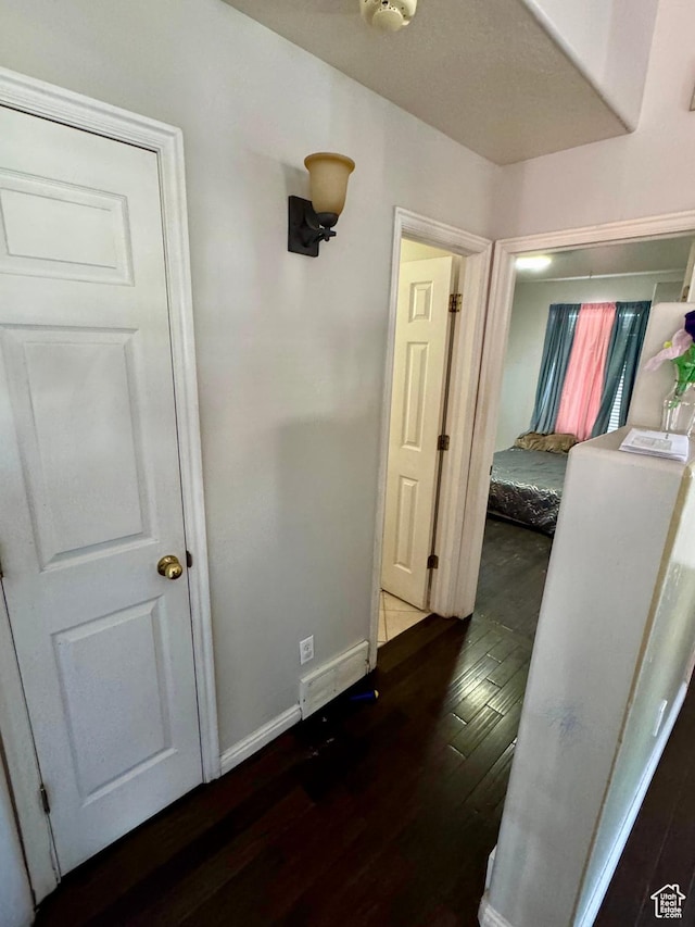 173 W Dimaggio Dr N, Tooele, UT 84074 - corridor with dark wood-style floors and baseboards