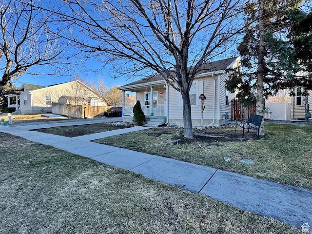 173 W Dimaggio Dr N, Tooele, UT 84074 - bungalow with a gate, covered porch, a front yard, and fence