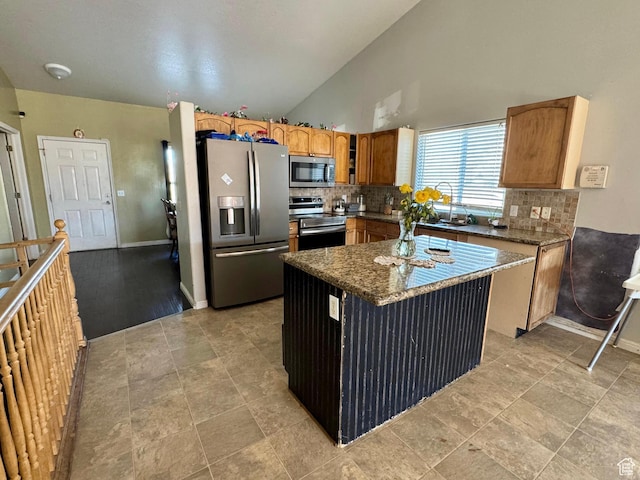 173 W Dimaggio Dr N, Tooele, UT 84074 - kitchen featuring backsplash, a kitchen island, appliances with stainless steel finishes, and a sink