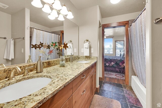 3518 N Moose Hollow Dr Unit 1402, Eden, UT 84310 - ensuite bathroom with double vanity, a textured ceiling, a sink, and connected bathroom