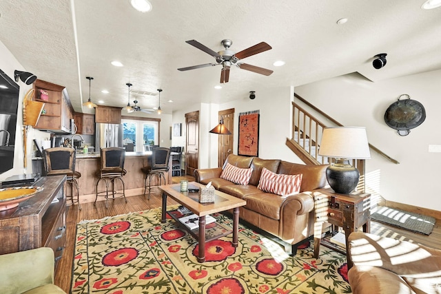 3518 N Moose Hollow Dr Unit 1402, Eden, UT 84310 - living area with a ceiling fan, a textured ceiling, recessed lighting, stairway, and light wood finished floors