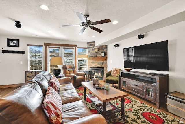 3518 N Moose Hollow Dr Unit 1402, Eden, UT 84310 - living room with recessed lighting, a fireplace, a textured ceiling, a ceiling fan, and wood finished floors