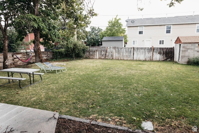 33 W 400 N, Orem, UT 84057 - view of yard with an outdoor structure, a fenced backyard, and a storage shed