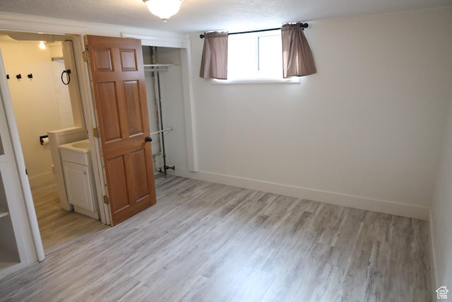 33 W 400 N, Orem, UT 84057 - unfurnished bedroom with baseboards, light wood-type flooring, and a closet