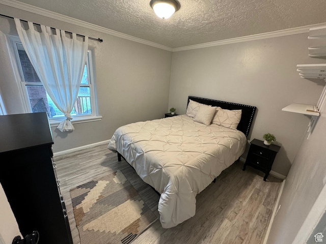 33 W 400 N, Orem, UT 84057 - bedroom featuring a textured ceiling, wood finished floors, baseboards, and ornamental molding