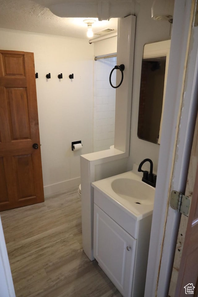 33 W 400 N, Orem, UT 84057 - bathroom featuring baseboards, toilet, wood finished floors, and vanity