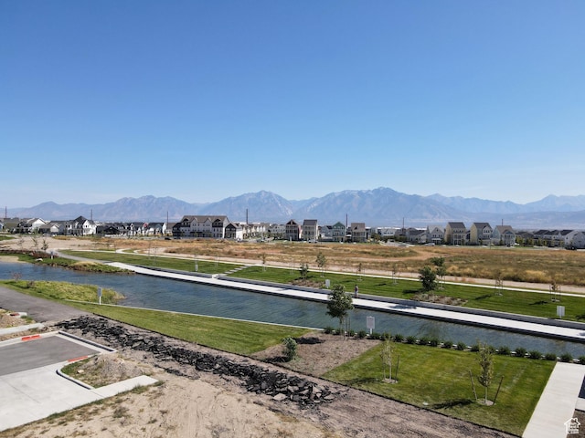view of mountain background featuring nearby suburban area