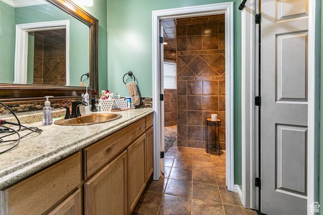 bathroom featuring tile patterned flooring and vanity