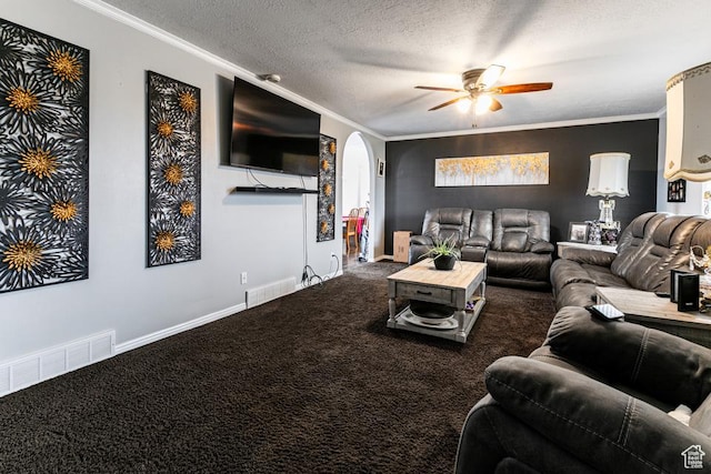 living area featuring crown molding, visible vents, and arched walkways