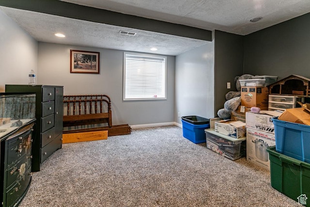 interior space featuring visible vents, recessed lighting, a textured ceiling, and baseboards