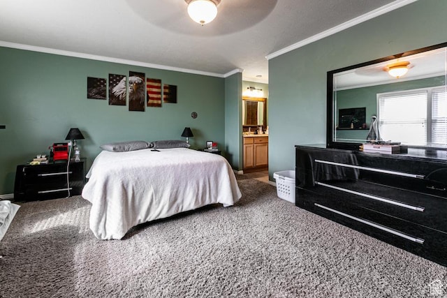 carpeted bedroom featuring ensuite bathroom, a ceiling fan, and crown molding