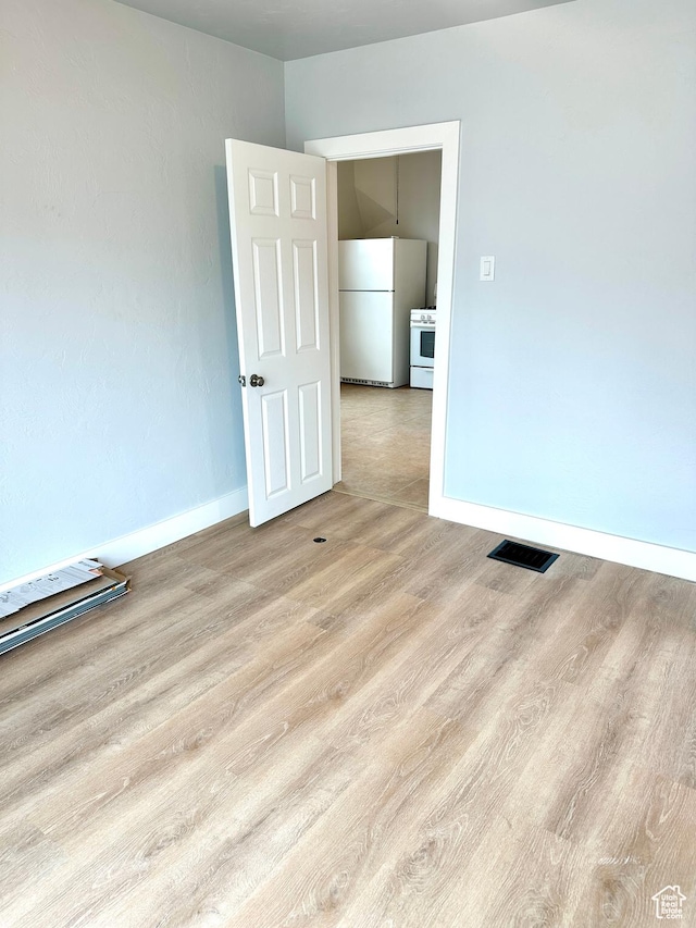 1022 W 400 N, Salt Lake City, UT 84116 - spare room featuring wood finished floors, baseboards, and visible vents