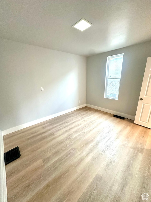 1022 W 400 N, Salt Lake City, UT 84116 - spare room with wood finished floors, baseboards, and visible vents