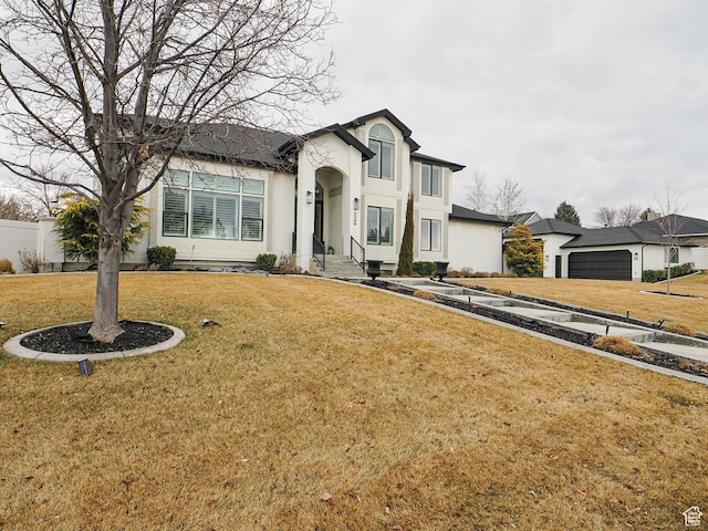 1146 W Jordan River Dr, South Jordan, UT 84095 - view of front of property featuring stucco siding, a front yard, and fence