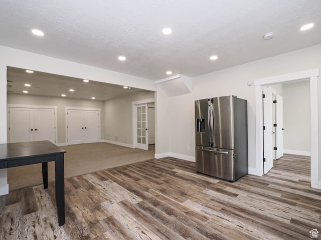 1146 W Jordan River Dr, South Jordan, UT 84095 - basement featuring recessed lighting, wood finished floors, stainless steel refrigerator with ice dispenser, and a textured ceiling