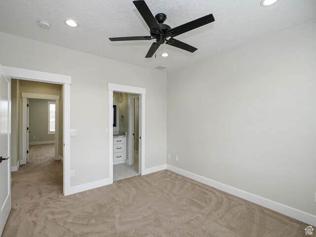 1146 W Jordan River Dr, South Jordan, UT 84095 - unfurnished bedroom featuring a textured ceiling, recessed lighting, baseboards, and light carpet