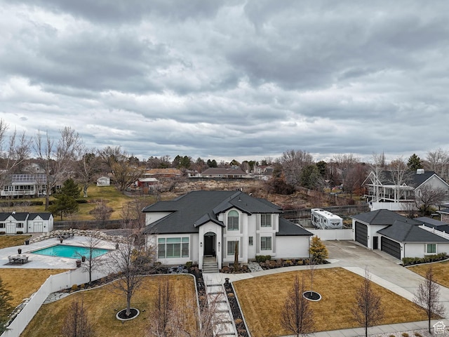 1146 W Jordan River Dr, South Jordan, UT 84095 - view of front of property with a front lawn, a fenced in pool, fence private yard, and a residential view