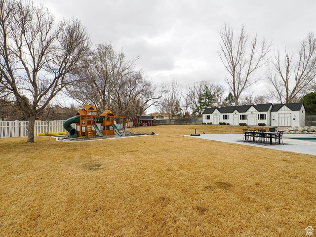 1146 W Jordan River Dr, South Jordan, UT 84095 - view of yard with a patio area, playground community, and fence