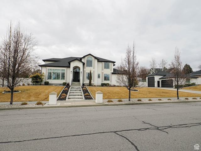 1146 W Jordan River Dr, South Jordan, UT 84095 - view of front of property featuring a front lawn, a garage, driveway, and stucco siding