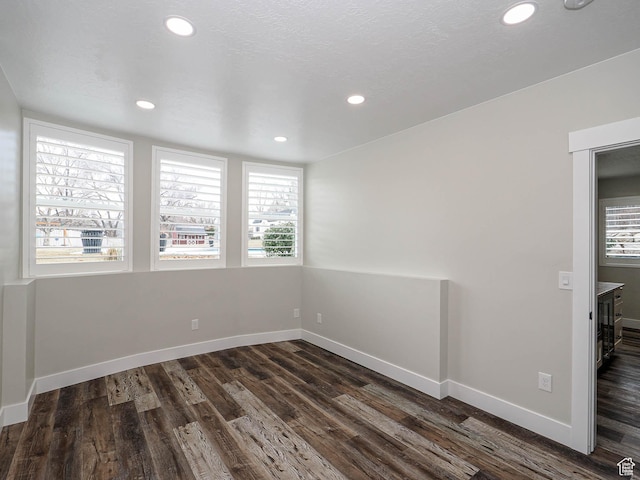 1146 W Jordan River Dr, South Jordan, UT 84095 - unfurnished room with dark wood finished floors, a healthy amount of sunlight, and baseboards