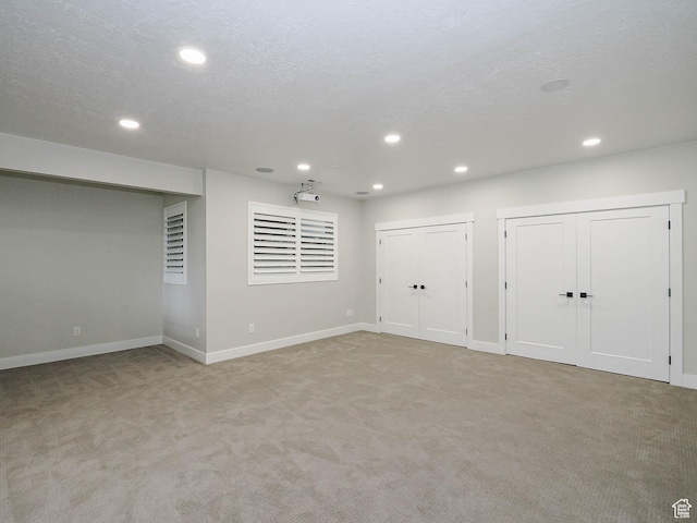 1146 W Jordan River Dr, South Jordan, UT 84095 - below grade area with recessed lighting, light colored carpet, and a textured ceiling