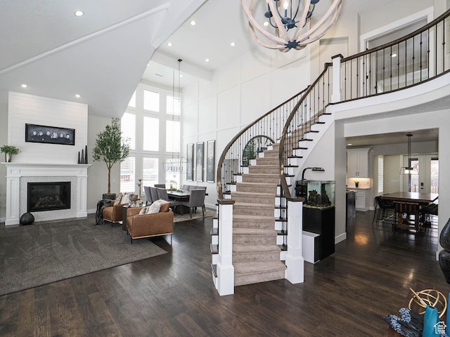 1146 W Jordan River Dr, South Jordan, UT 84095 - stairway featuring a notable chandelier, wood finished floors, and a wealth of natural light