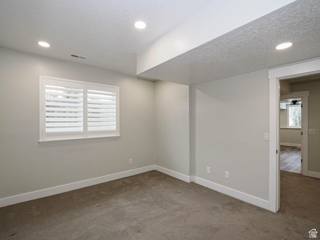1146 W Jordan River Dr, South Jordan, UT 84095 - below grade area featuring baseboards, a textured ceiling, and carpet flooring