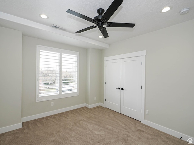 1146 W Jordan River Dr, South Jordan, UT 84095 - unfurnished bedroom with visible vents, light carpet, a textured ceiling, recessed lighting, and baseboards