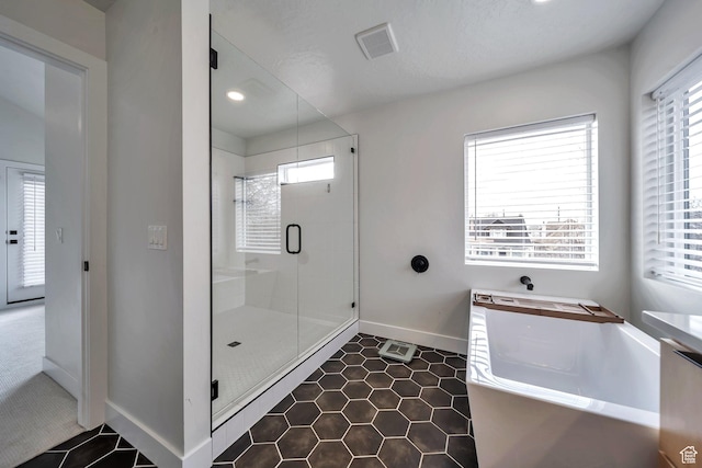 869 S Washington St Unit 101, Salt Lake City, UT 84101 - full bathroom featuring baseboards, visible vents, recessed lighting, a stall shower, and tile patterned floors