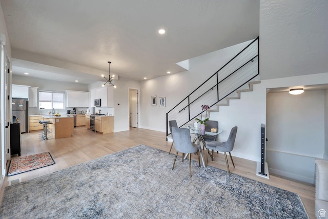 869 S Washington St Unit 101, Salt Lake City, UT 84101 - interior space featuring a chandelier, recessed lighting, stairs, and light wood-style floors