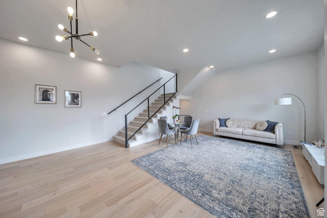 869 S Washington St Unit 101, Salt Lake City, UT 84101 - living room with baseboards, stairway, recessed lighting, an inviting chandelier, and wood finished floors