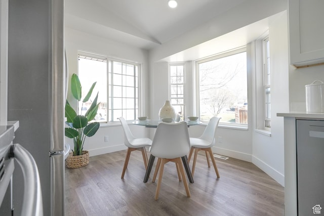 865 W 1800 N, Mapleton, UT 84664 - dining space with baseboards, lofted ceiling, light wood-style floors, and visible vents
