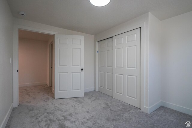 865 W 1800 N, Mapleton, UT 84664 - unfurnished bedroom featuring a closet, carpet floors, and baseboards