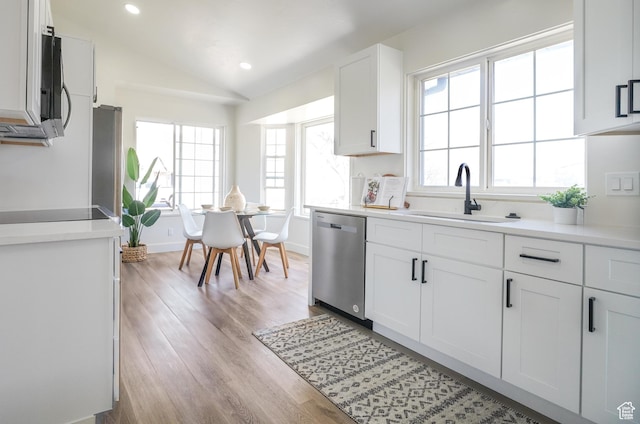 865 W 1800 N, Mapleton, UT 84664 - kitchen with light wood-style flooring, a sink, stainless steel appliances, light countertops, and lofted ceiling
