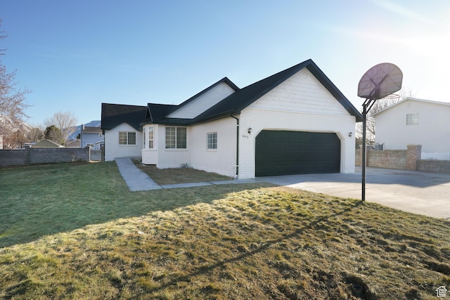 865 W 1800 N, Mapleton, UT 84664 - view of front facade featuring fence, an attached garage, a front lawn, concrete driveway, and brick siding