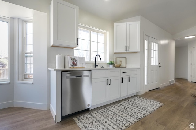 865 W 1800 N, Mapleton, UT 84664 - kitchen with light wood finished floors, white cabinetry, light countertops, and stainless steel dishwasher