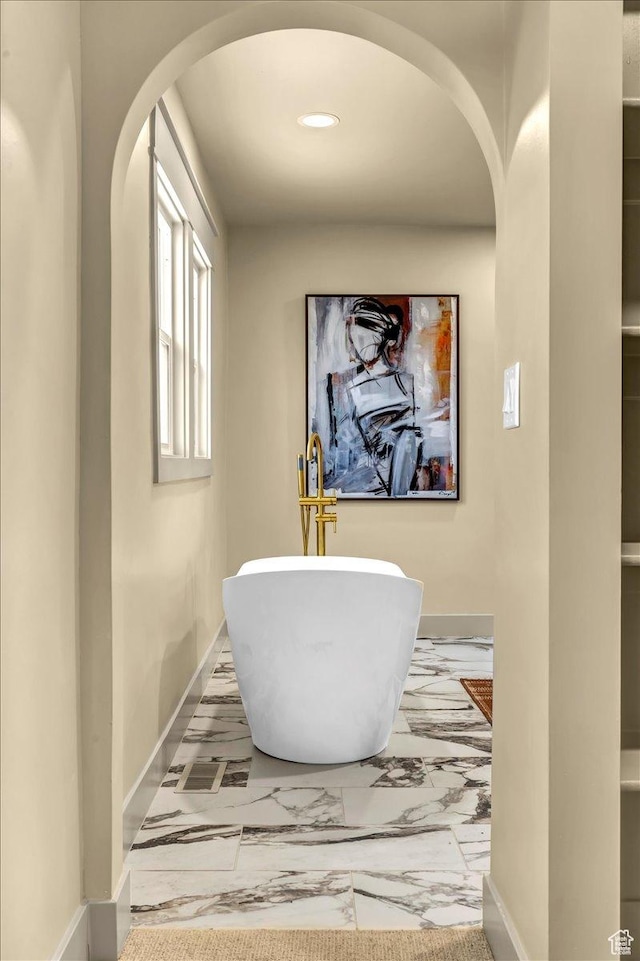 1444 E Sherman Ave, Salt Lake City, UT 84105 - corridor featuring marble finish floor, arched walkways, and baseboards