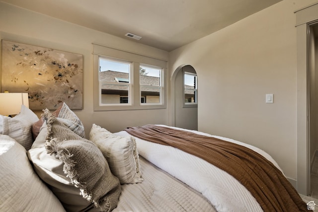 1444 E Sherman Ave, Salt Lake City, UT 84105 - bedroom featuring arched walkways and visible vents