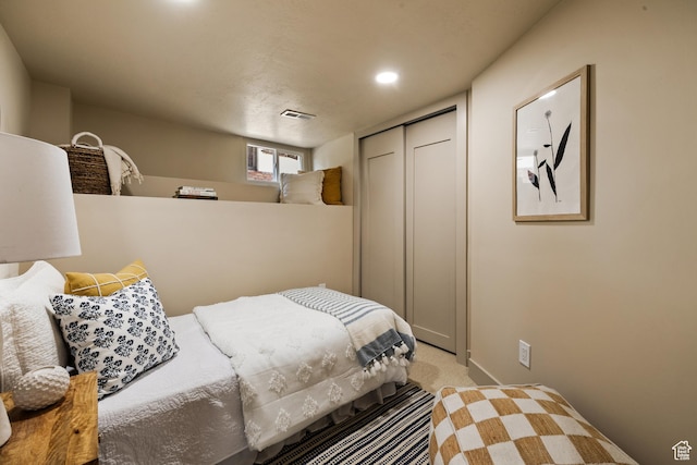 1444 E Sherman Ave, Salt Lake City, UT 84105 - bedroom featuring a closet, visible vents, and light carpet