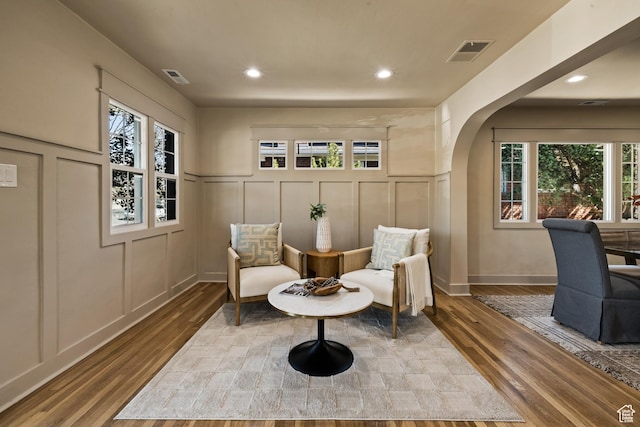 1444 E Sherman Ave, Salt Lake City, UT 84105 - sitting room featuring a decorative wall, visible vents, and wood finished floors