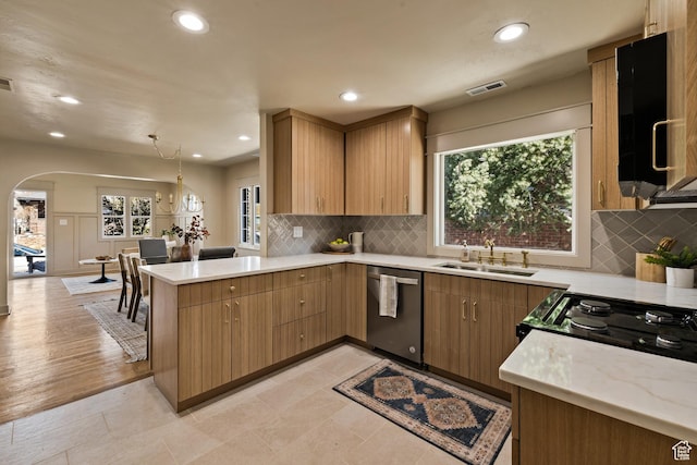 1444 E Sherman Ave, Salt Lake City, UT 84105 - kitchen featuring a sink, arched walkways, visible vents, dishwasher, and a peninsula