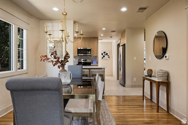 1444 E Sherman Ave, Salt Lake City, UT 84105 - dining area featuring visible vents, recessed lighting, and light wood-type flooring