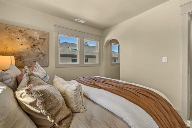 1444 E Sherman Ave, Salt Lake City, UT 84105 - bedroom featuring arched walkways and visible vents