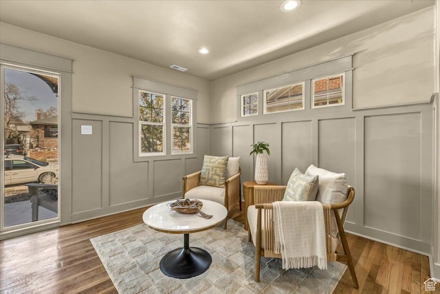 1444 E Sherman Ave, Salt Lake City, UT 84105 - sitting room with a decorative wall, recessed lighting, wood finished floors, and visible vents