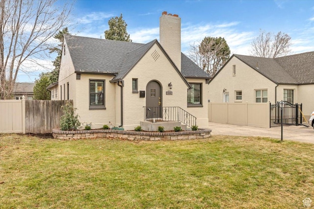 1662 E Browning Ave, Salt Lake City, UT 84105 - view of front of property featuring a front yard, fence, and a chimney