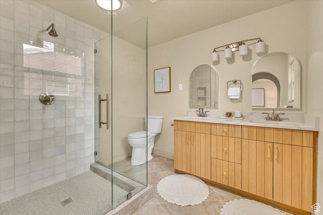 1662 E Browning Ave, Salt Lake City, UT 84105 - full bath featuring a sink, toilet, double vanity, and a shower stall